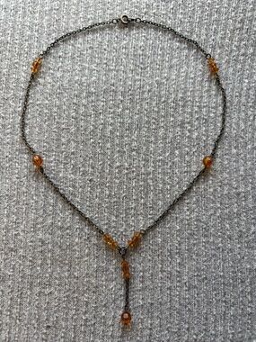Vintage dark metal tone orange beaded dangly necklace